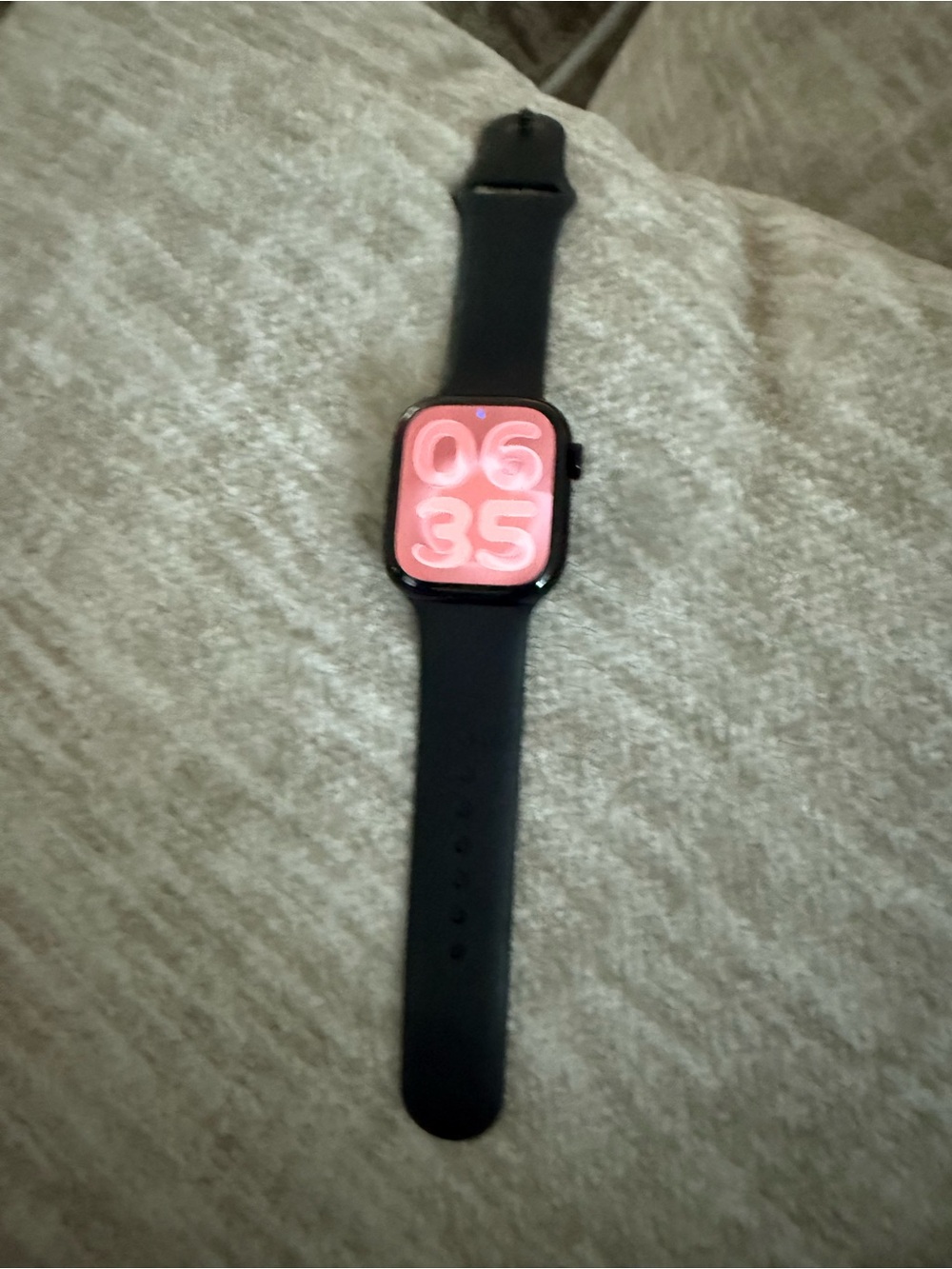 Apple Watch Series 11. GPS. 44mm Jet black aluminum case with black sport band.